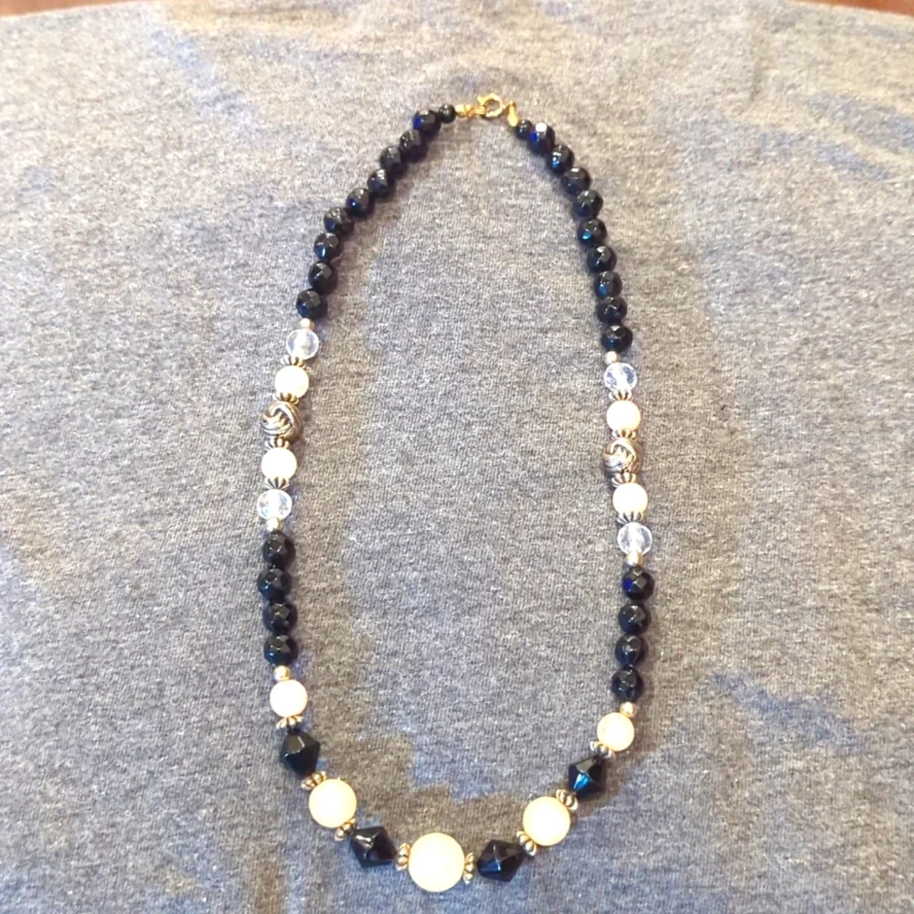 Women's black, pink and clear ball necklace.